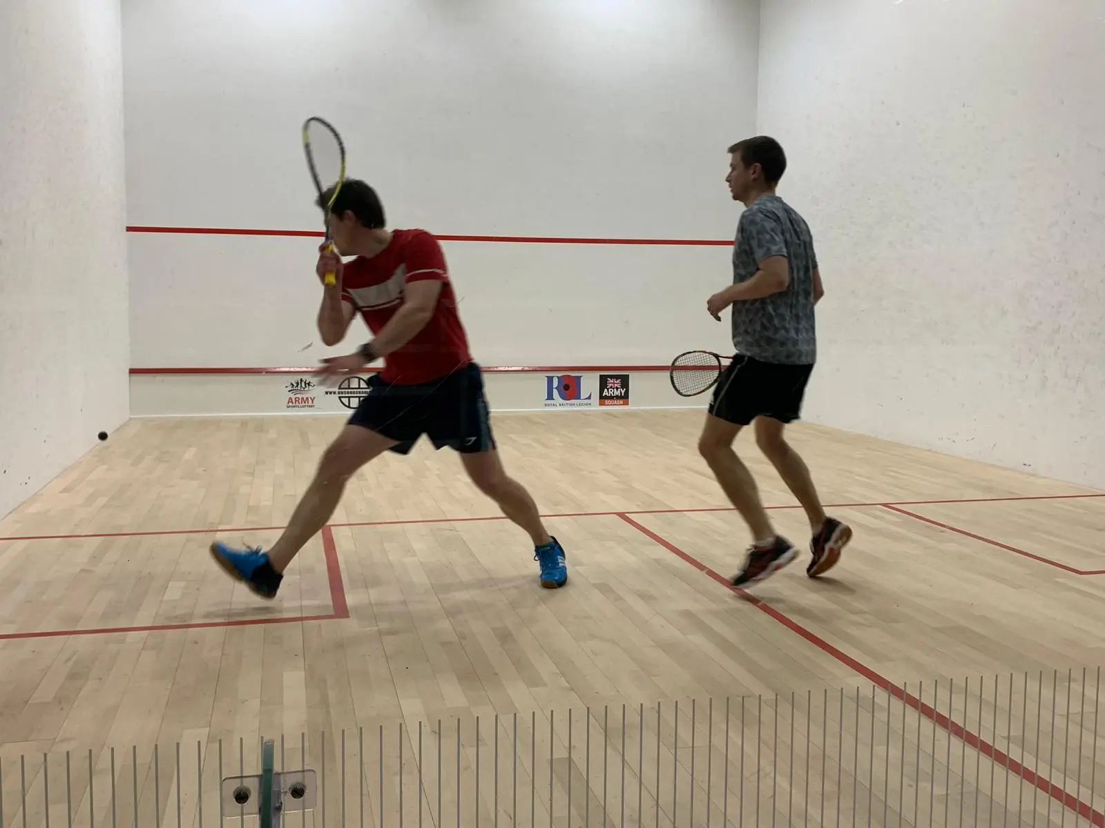 Friendly squash players competing at Scamps Club Surrey